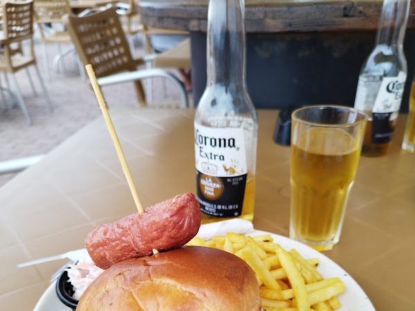 A fresh plate of food with a glass of wine at Lino Kiosk